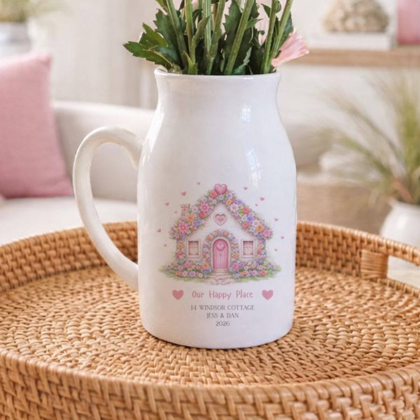 Personalised New Home flower pitcher jug with floral design on a woven tray in a cozy living room.