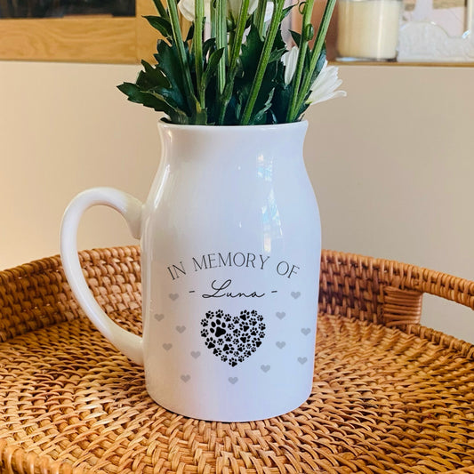 Pet Memorial White pitcher with 'In Memory of' text on a woven tray with flowers