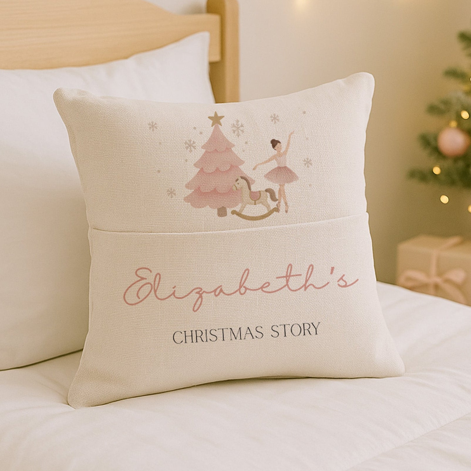 Decorative pillow with a Christmas design and text on a bed with a festive background