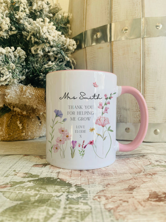 Personalised  Teacher Pink Handled Mug. Featuring the saying 'Thank you for helping me grow' and personalised with the teachers name along with who it's from.