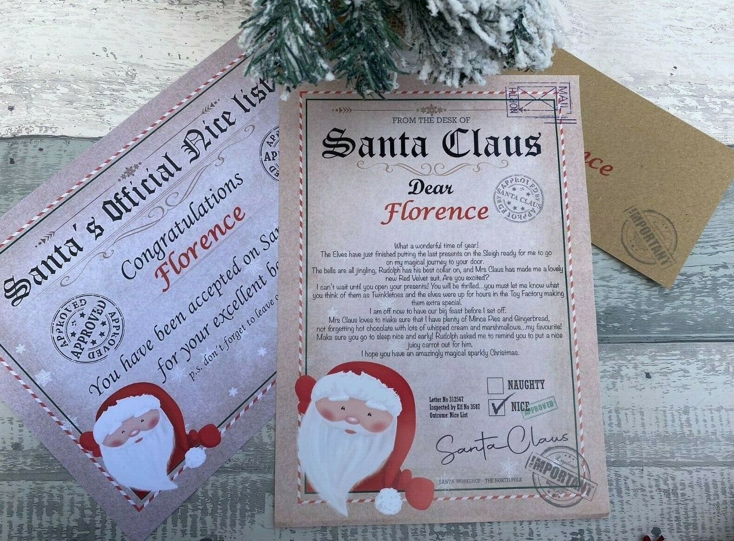 Personalised Letter from Santa Claus on a wooden surface with decorative elements.