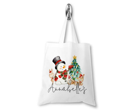 White tote bag with a snowman and Christmas tree design, featuring the name 'Annabelle'.