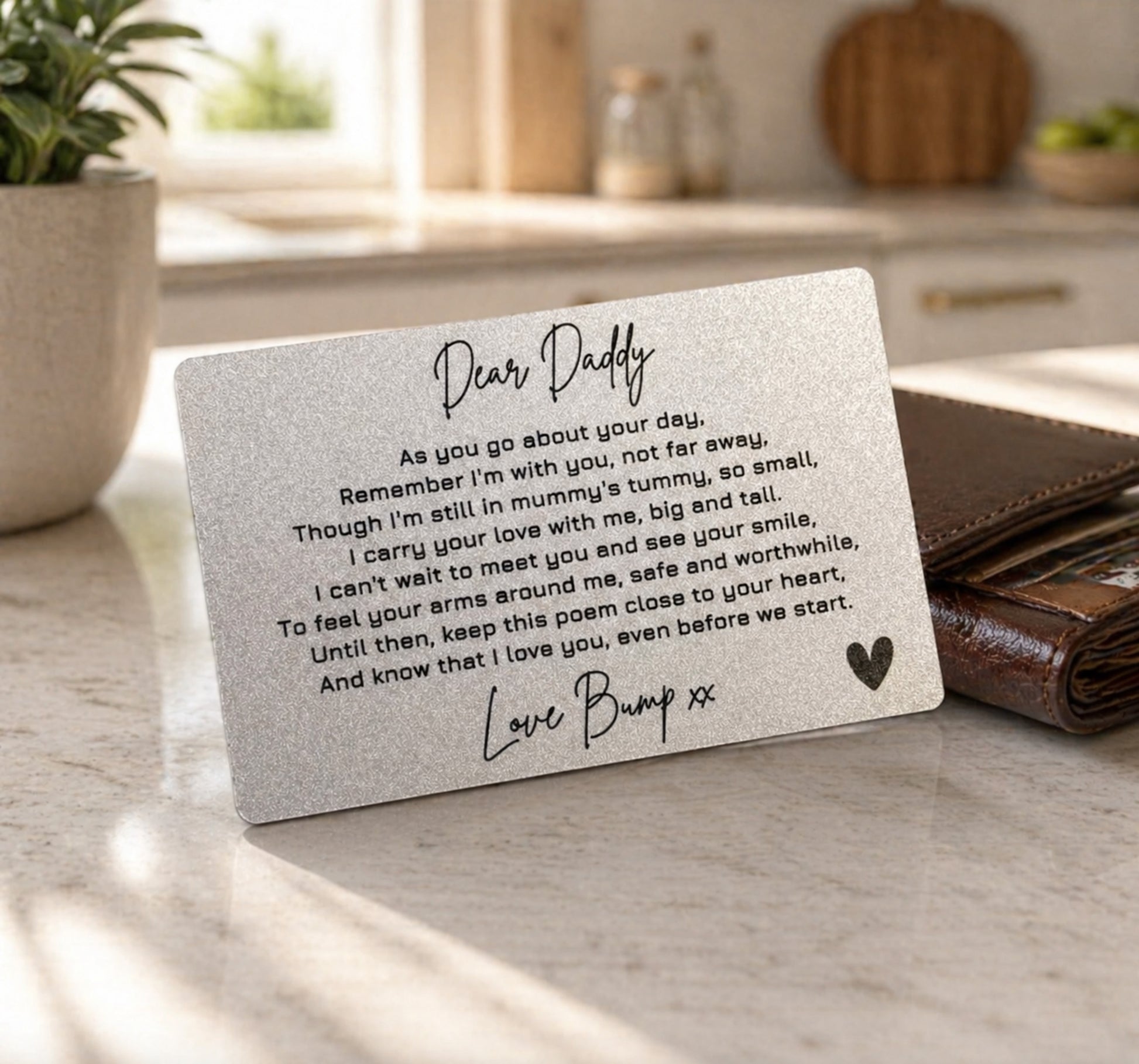 Card with a message to a father from his unborn child on a kitchen counter.